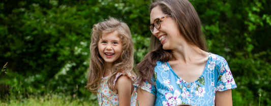 A Mom and Daughter, laughing with joy, enjoying Piper and Leaf tea for Mother's Day.