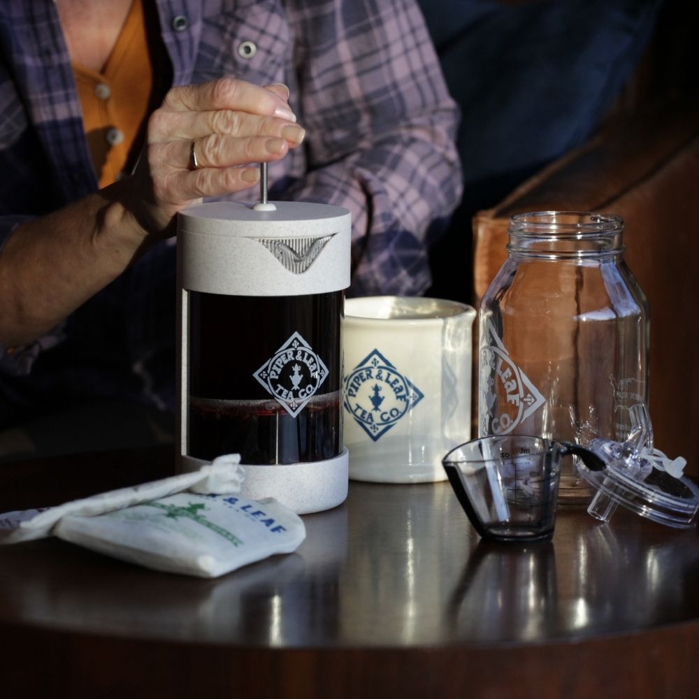 Woman brewing Piper & Leaf tea in a Piper Press