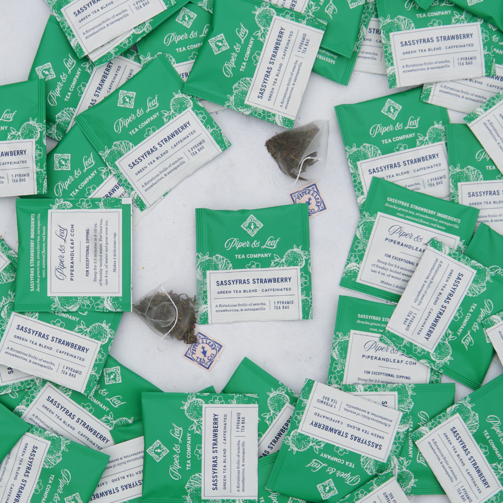A pile of Piper & Leaf Tea Co. Sassyfras Strawberry Case of Individually Wrapped Tea Bags- 50ct.