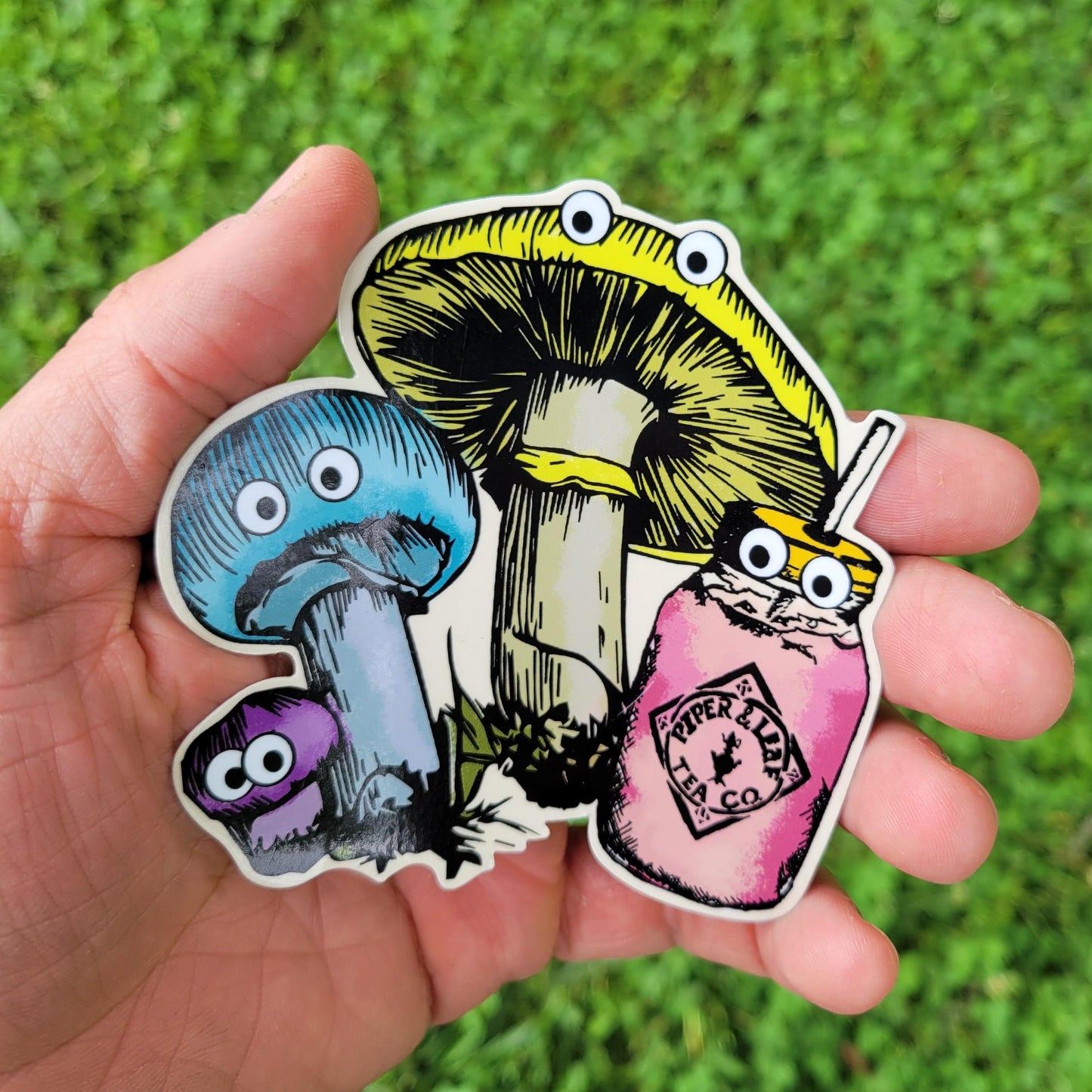 Fungi(s) sticker, held in hand for size