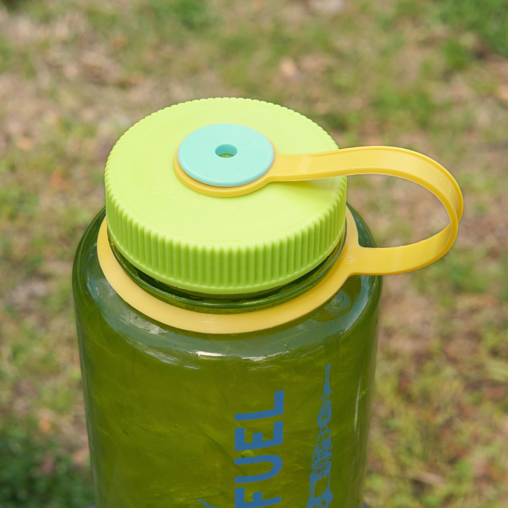Rocket Fuel Edition Piper & Leaf Nalgene sports water bottle with a yellow flip cap and carrying loop.