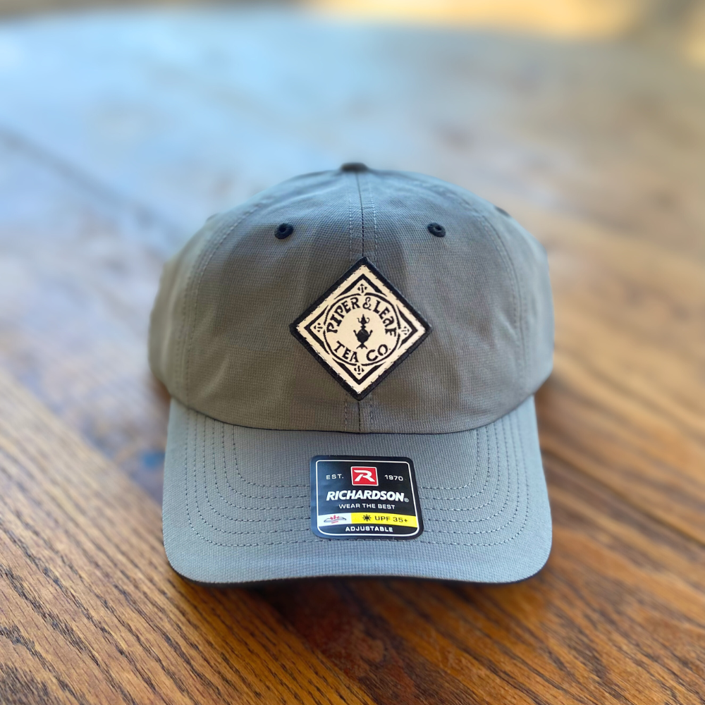 A Piper & Leaf Tea Co. P&L Sport Cap with a white logo on it.