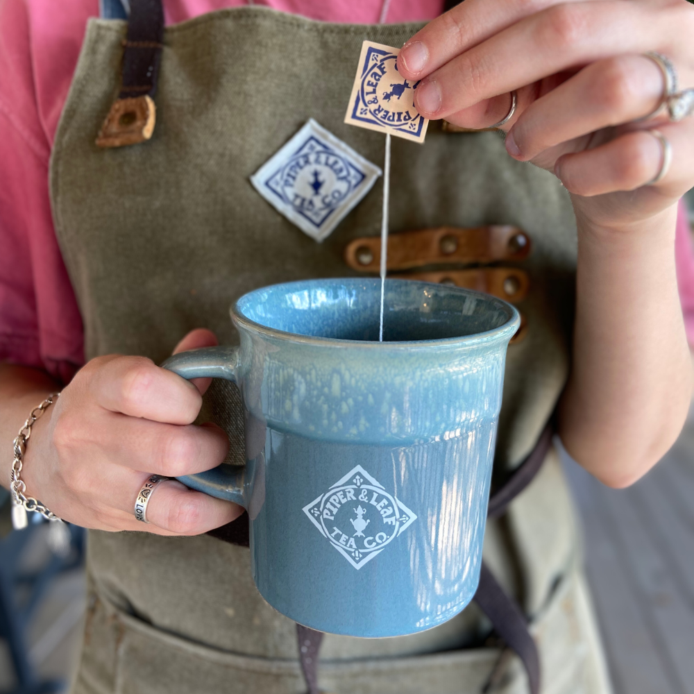 P&L logo mug with tea bag sachet
