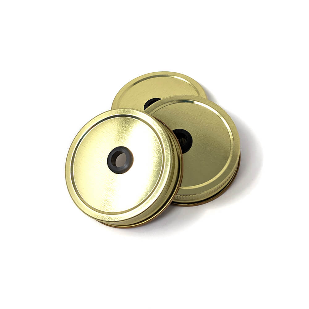 A 3 pack of mason jar drinking lids - lid with straw hole and grommet