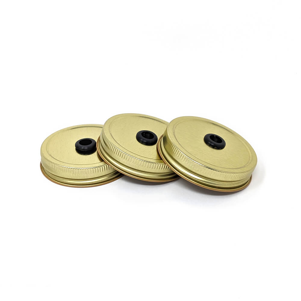 A 3 pack of mason jar drinking lids - lid with straw hole and grommet