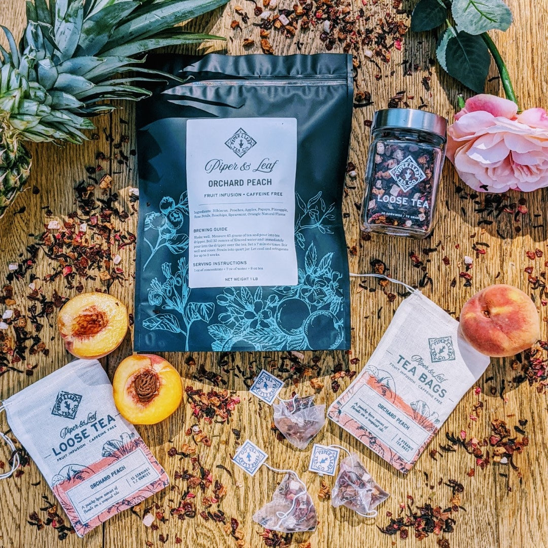 A bag of Orchard Peach Bulk Sachets - 70ct Tea Bags from Piper & Leaf Tea Co. on a tropical isle.