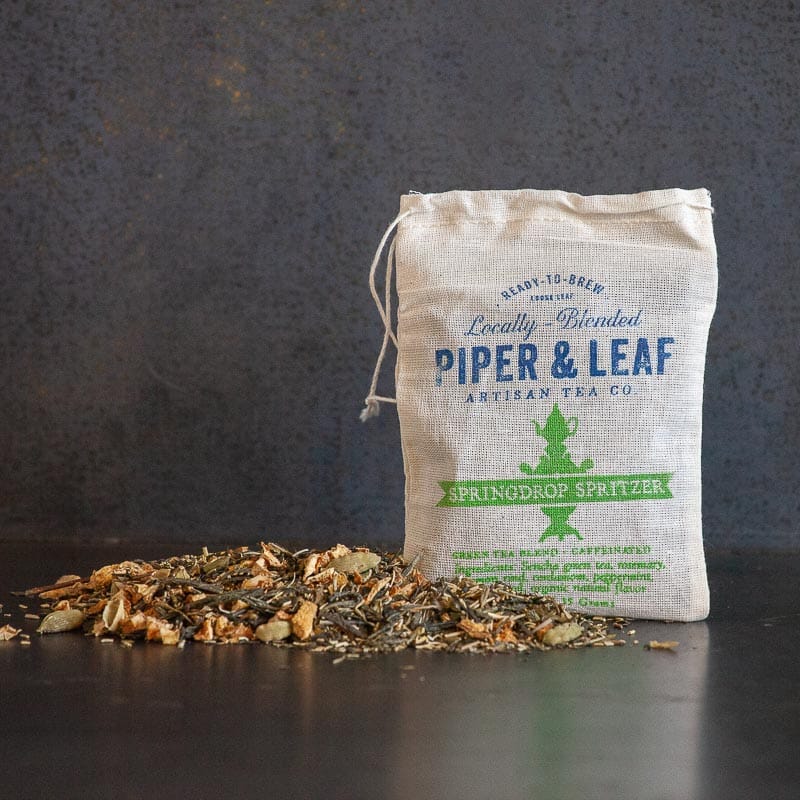 Spilled loose leaf beside a muslin bag (Springdrop Spritzer)