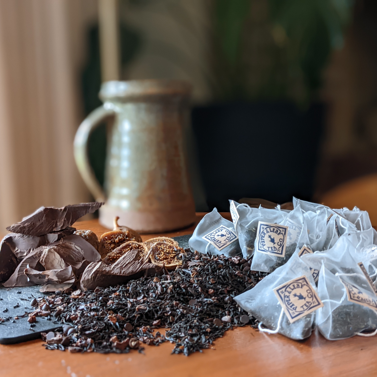 chocol-tea sachet bags next to mug and ingredients