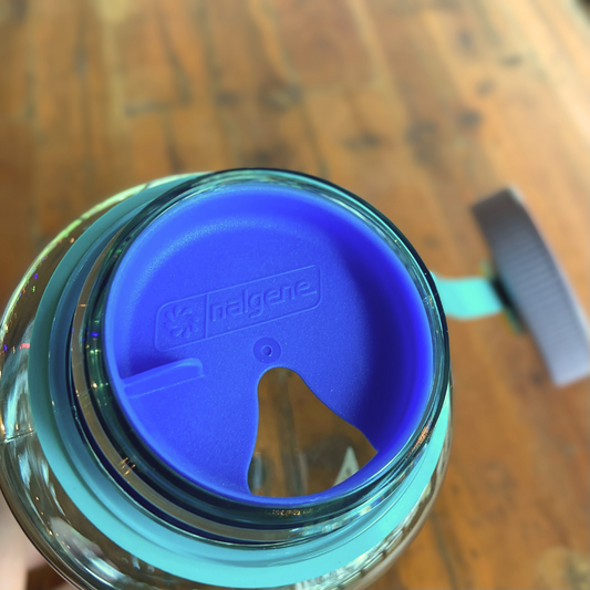 A Nalgene Easy Sipper Splash Cover bottle with a Piper & Leaf Tea Co. lid on it, perfect for sipping on tea.