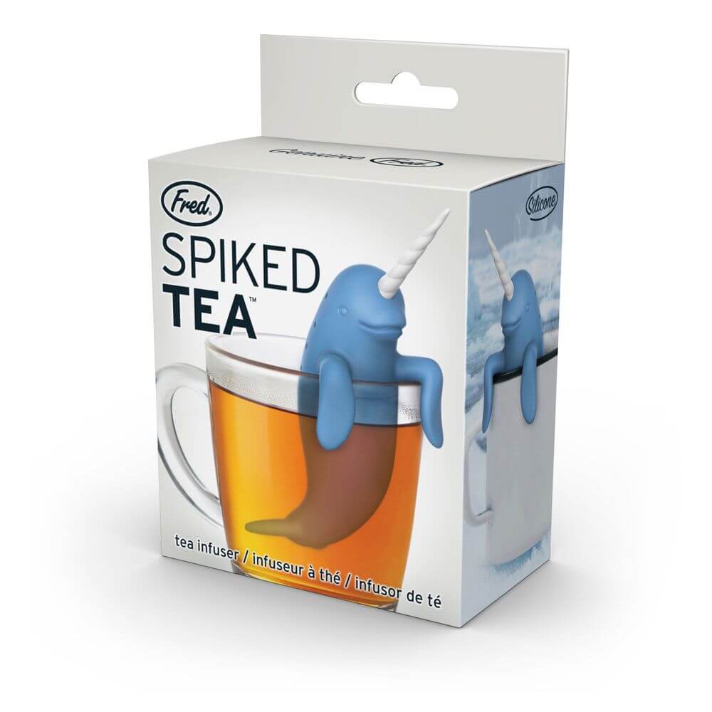 The box for the narwhal shaped Fred-brand tea strainer over a mug: the CuteTea