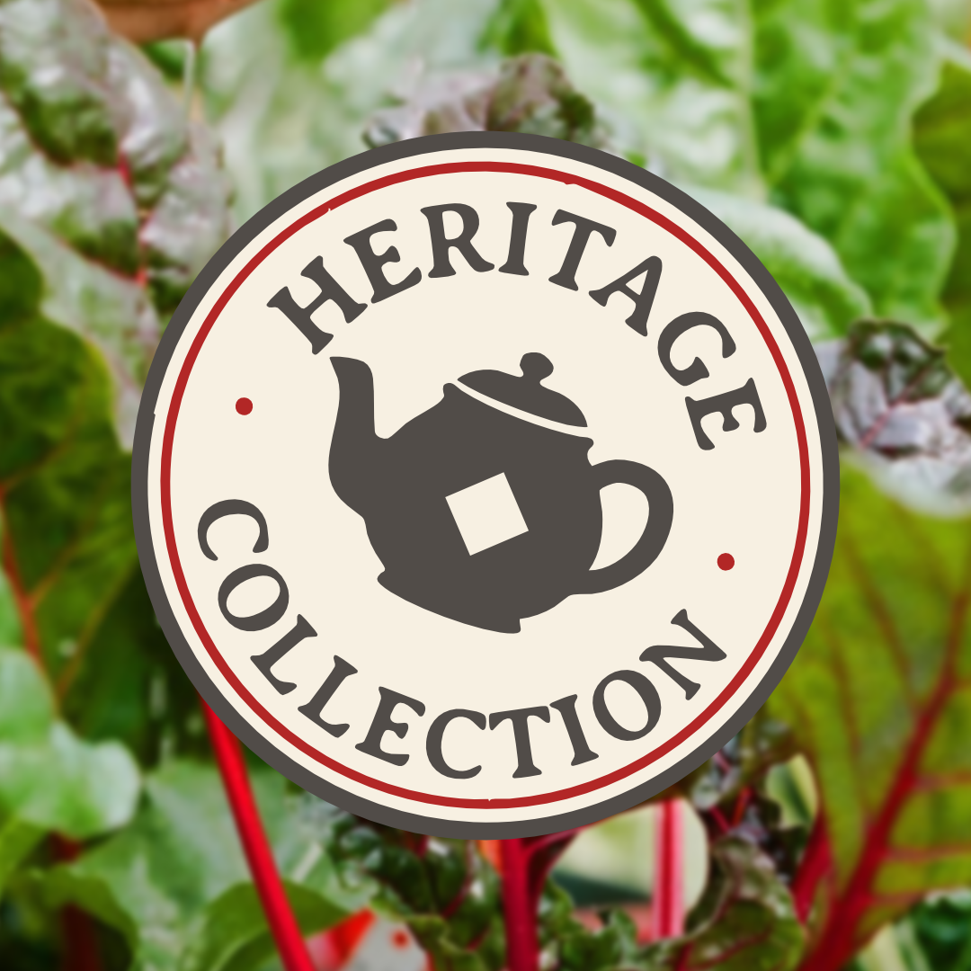 A circular sign with a teapot illustration and the text “Heritage Collection” is displayed in front of leafy green plants.