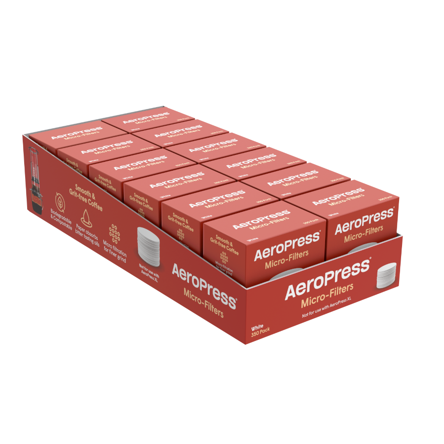 A display box contains multiple packs of AeroPress Paper Micro-Filters by AeroPress, each pack clearly labeled and neatly stacked.