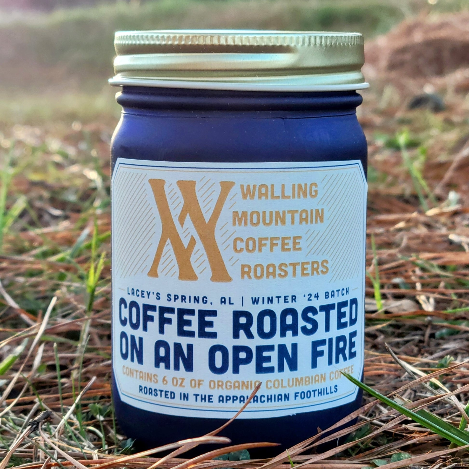 The "Walling Mtn. 6oz Jar of Coffee" features organic Colombian coffee, roasted with traditional techniques over an open fire in the Appalachian foothills and adopting natural farming practices.