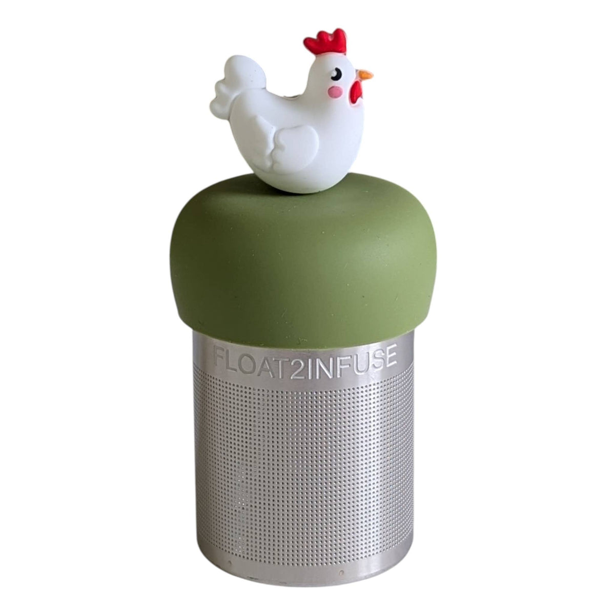 Brighten up your tea time with the Float2infuse Tea Infuser: Chicken - Floating Tea Infuser, a whimsical loose-leaf tea accessory featuring a green silicone lid topped with a charming small white chicken figurine.