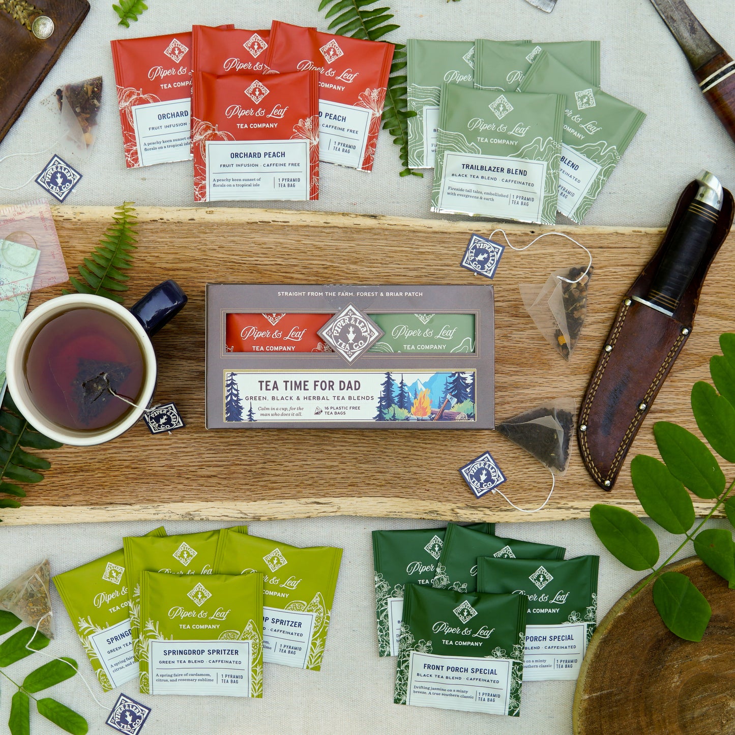 The Piper & Leaf Tea Co. "Tea Time For Dad" box includes 16 individually wrapped tea bags—perfectly arranged with a cup of tea and decorative accents for an ideal Father's Day gift.