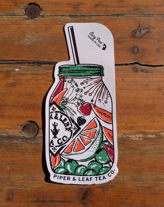 Brighten your collection with the Jar of Berries Sticker from Ninja Transfers, shaped like a mason jar with fruit, greens, and a straw on a wooden surface.