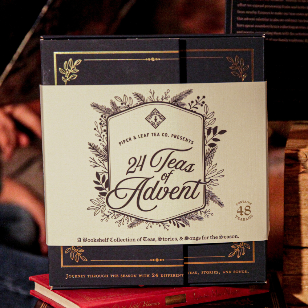 A box of the "24 Teas of Advent—Piper and Leaf Advent Calendar 2024" by Piper & Leaf Tea Co. features an advent calendar-style collection of 24 different teas for the holiday season, decorated with botanical designs, and includes 48 tea bags.