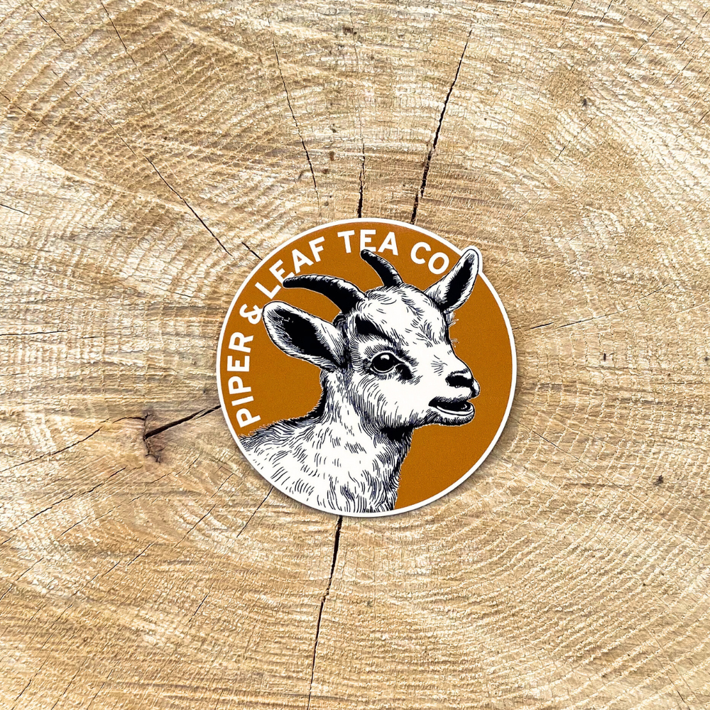 A Clyde the Goat sticker with an image of a goat, perfect for decorating your Piper & Leaf Tea Co. tea-bottle.