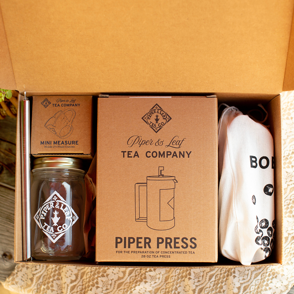 A Piper & Leaf Tea Co. Boba Tea Kit containing a tea box and a mug.