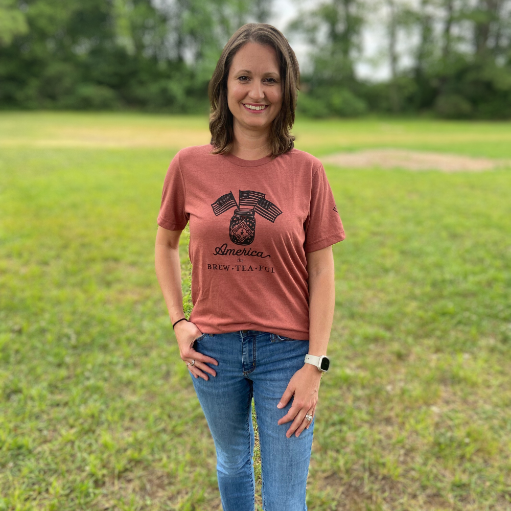 a P&L employee modeling our americal the brew-tea-ful shirt
