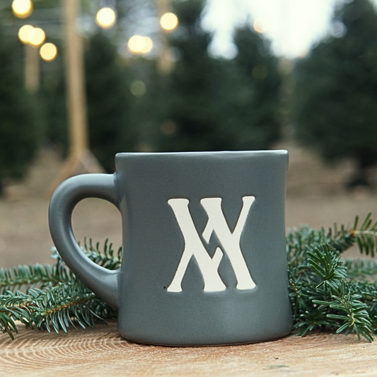 Walling mtn. coffee mug in sage green with an etched in cream logo