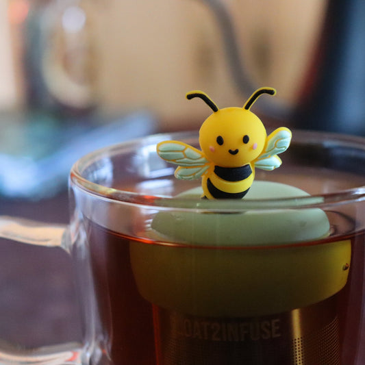The Float2infuse Bumble Bee - Floating Tea Infuser is an adorable and reusable loose-leaf tea accessory that floats on top of your tea in a clear glass mug, adding both charm and functionality to your daily brew.