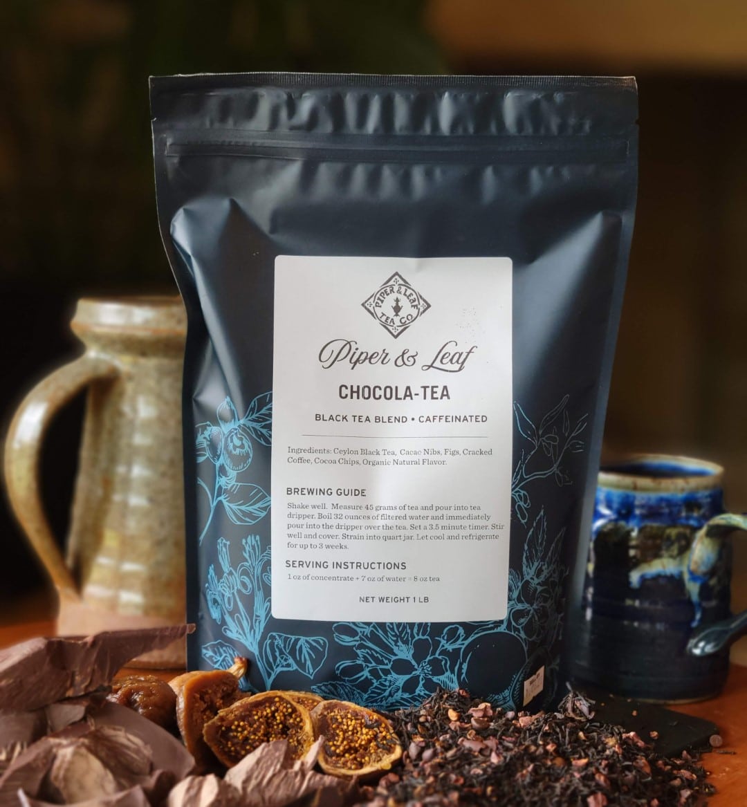 A Piper & Leaf Tea Co. Chocola-Tea Pound Bag - 190 servings, specifically sencha, sitting on a table.