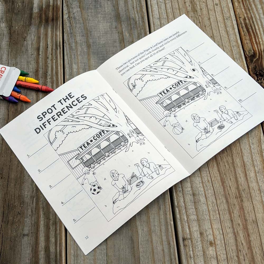 A coloring book open to a page titled "Spot the Differences" showing two similar drawings of the Piper & Leaf Farm