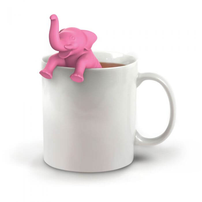 A elephant shaped Fred-brand tea strainer in a mug: Big Brew