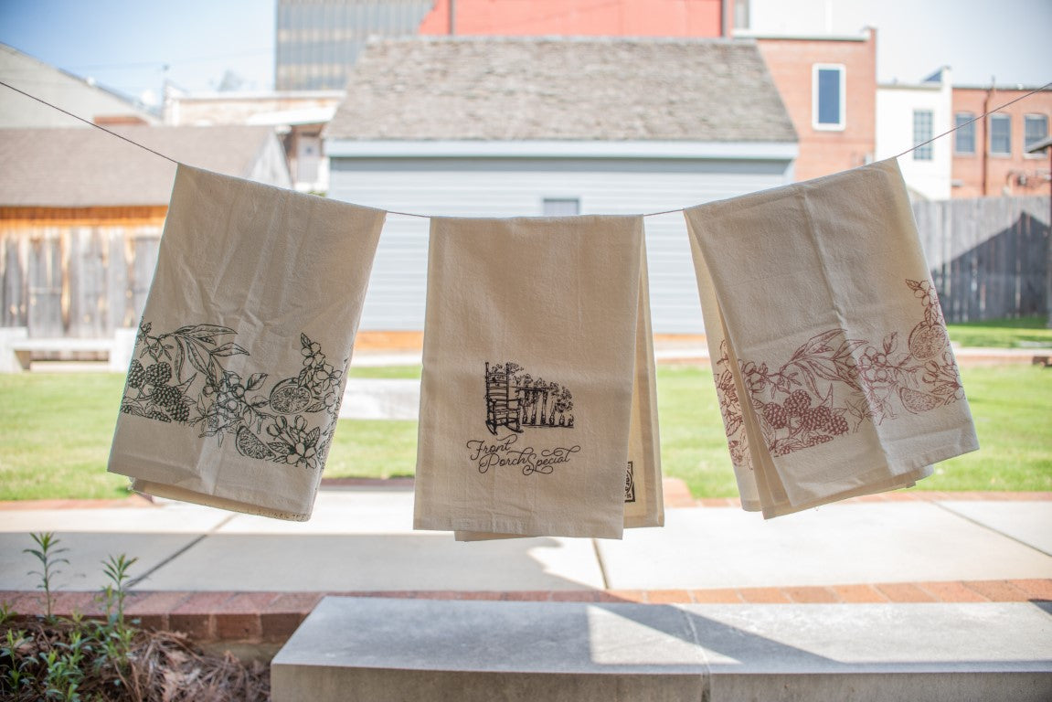 Garden Tea Party Tea Towel handing on a clothes line with the Front Porch Special