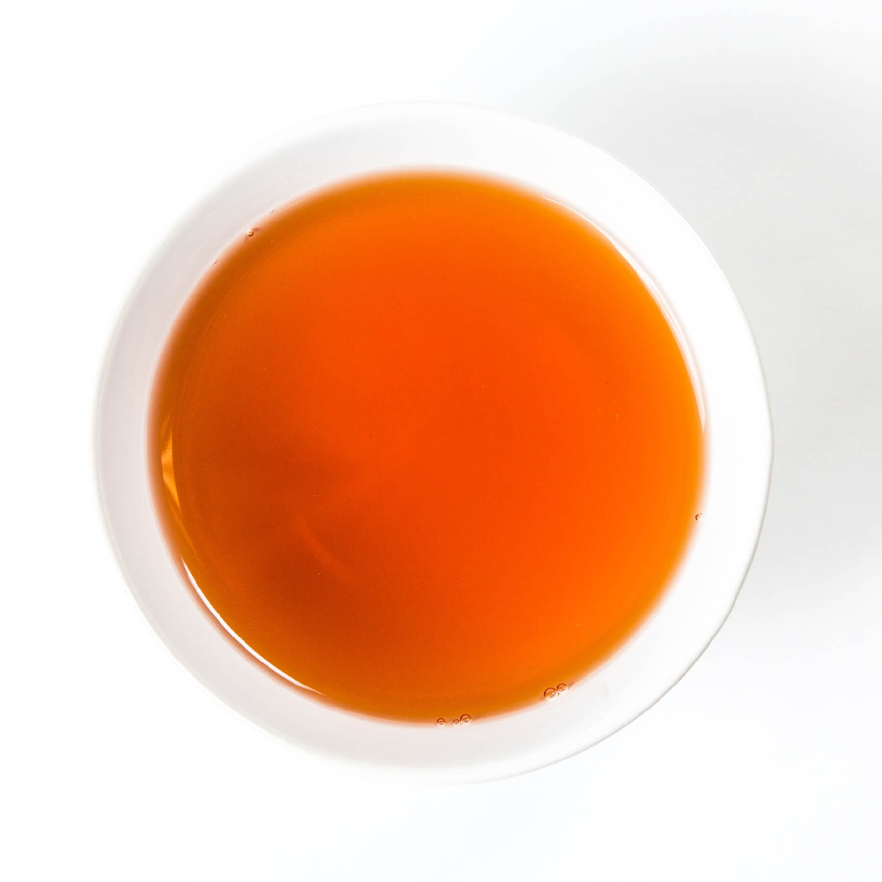a small teacup of freshly brewed tea