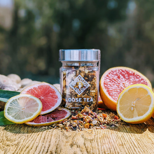 A refreshing Golden Hour Tonic Glass Jar of tea infused with grapefruit and a hint of ginger for a delightful citrusy flavor, brought to you by Piper & Leaf Tea Co.