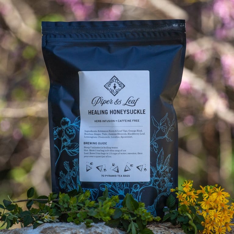 A Healing Honeysuckle Bulk Sachets - 70ct Tea Bags with blue text on it, made by Piper & Leaf Tea Co.