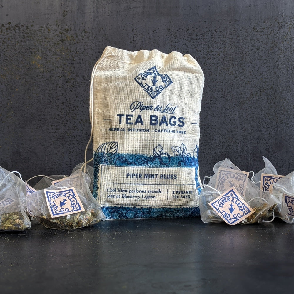 Tea bags piled around a 9ct muslin bag (Piper Mint Blues)