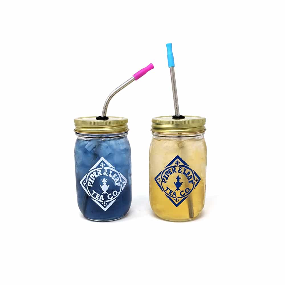 Two pint-sized Piper & Leaf mason jars with reusable metals straws