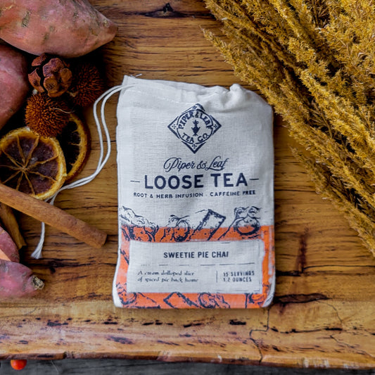 Sweetie Pie Chai Muslin Bag of Loose Leaf Tea - 15 Servings by Piper & Leaf Tea Co. on a rustic wooden table.