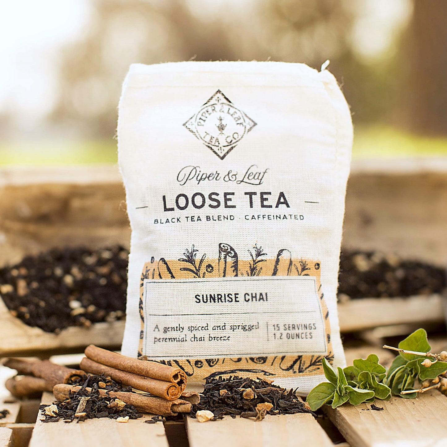 A Sunrise Chai Muslin Bag of Loose Leaf Tea - 15 Servings by Piper & Leaf Tea Co. sitting on a wooden table.