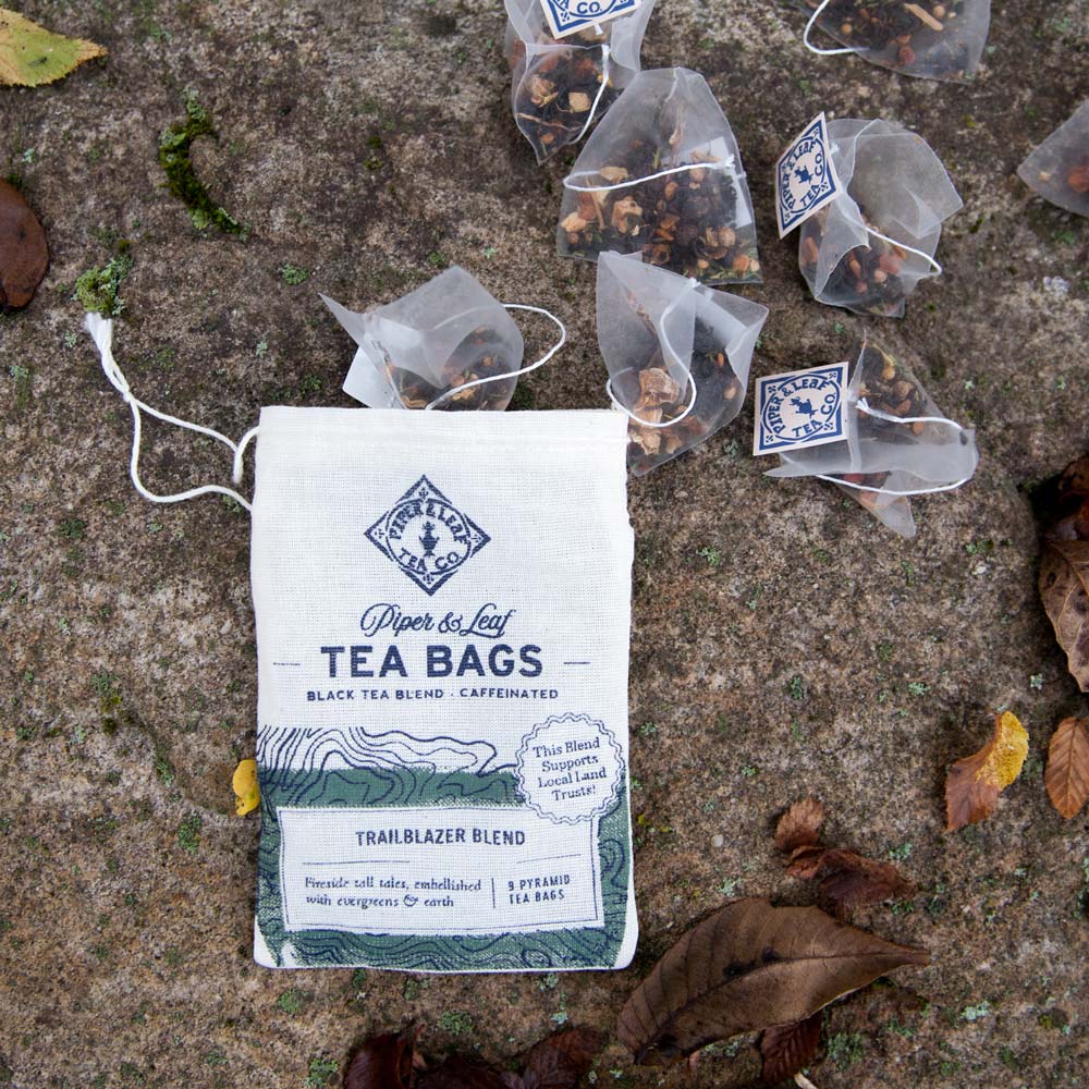 A muslin of Trailblazer Blend tea bags spilled out onto a rock