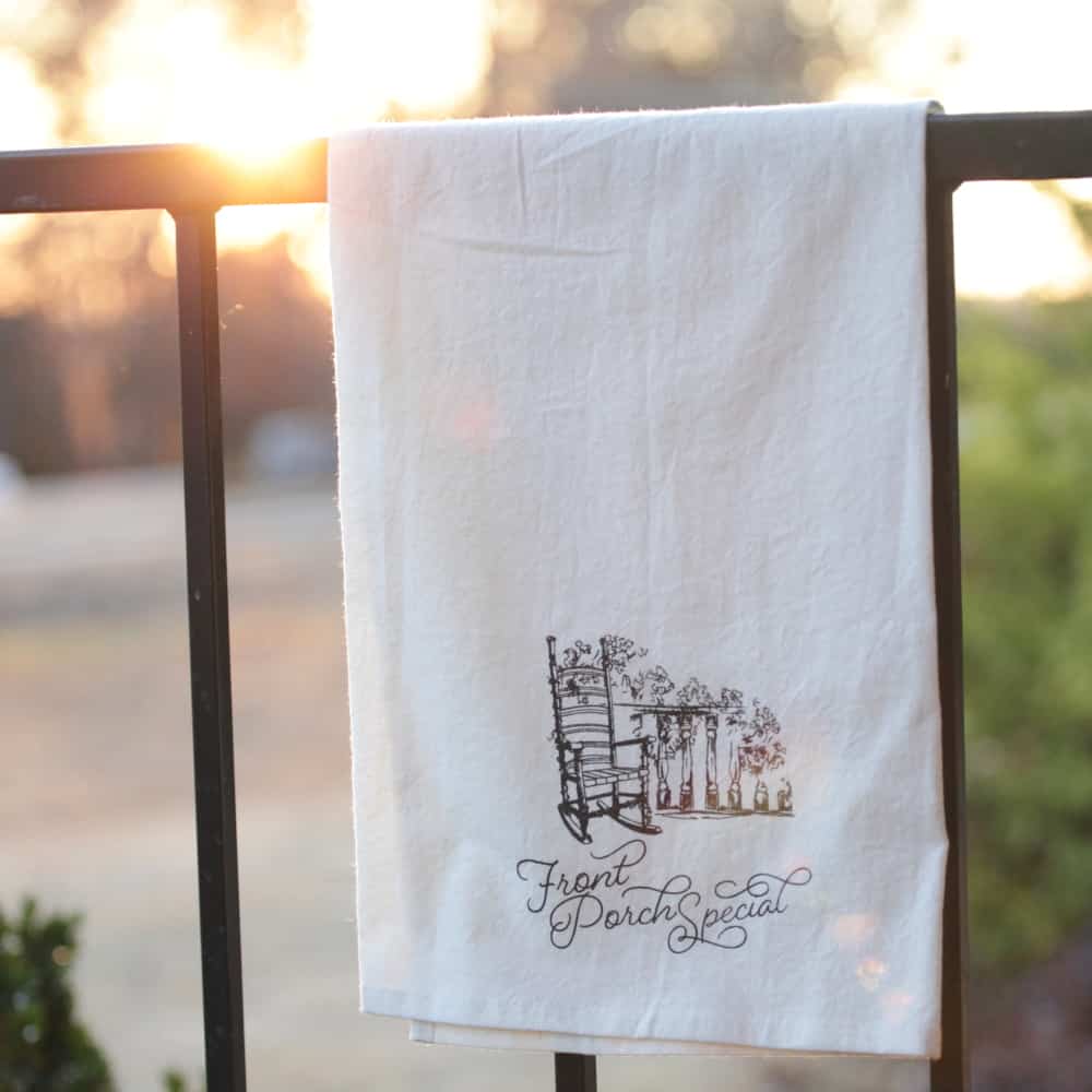 Tea Towel: "Front Porch Special" with a sketch of a rocking chair on a front porch