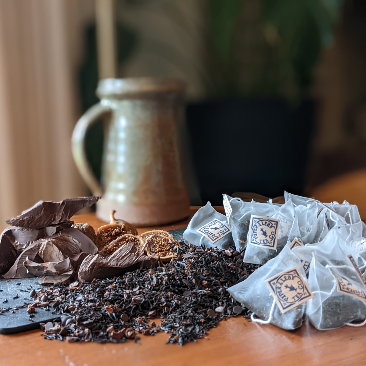 chocola-tea sachets next to mug and ingredients