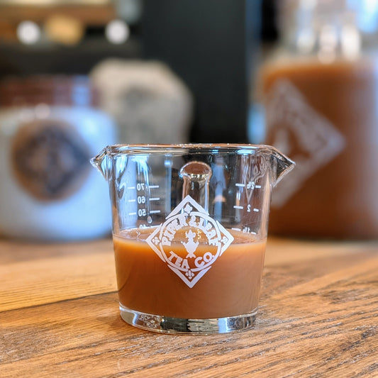 Piper Mini Measure - a tiny glass measuring cup with the Piper & Leaf logo